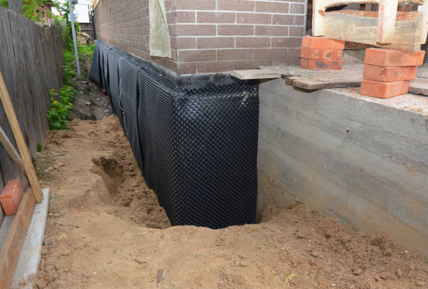 Happy homeowners after waterproofing job in Akron